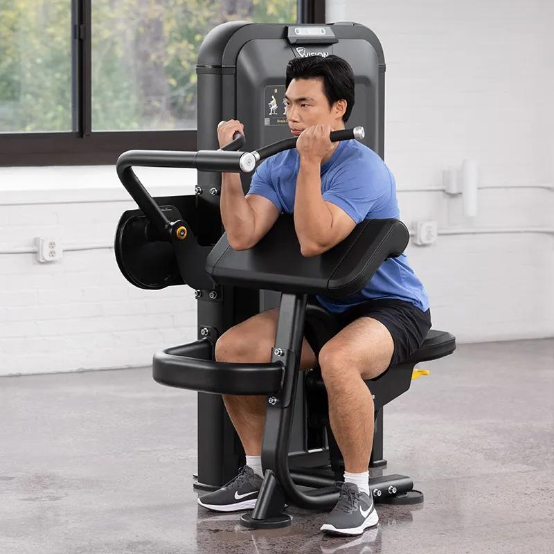 Person performing a curl on the Keystone Biceps Curl machine, seated with elbows resting on the angled pad and hands gripping the rotating handles.