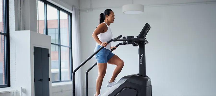 Woman exercising on the Vision Summit Stairclimber.