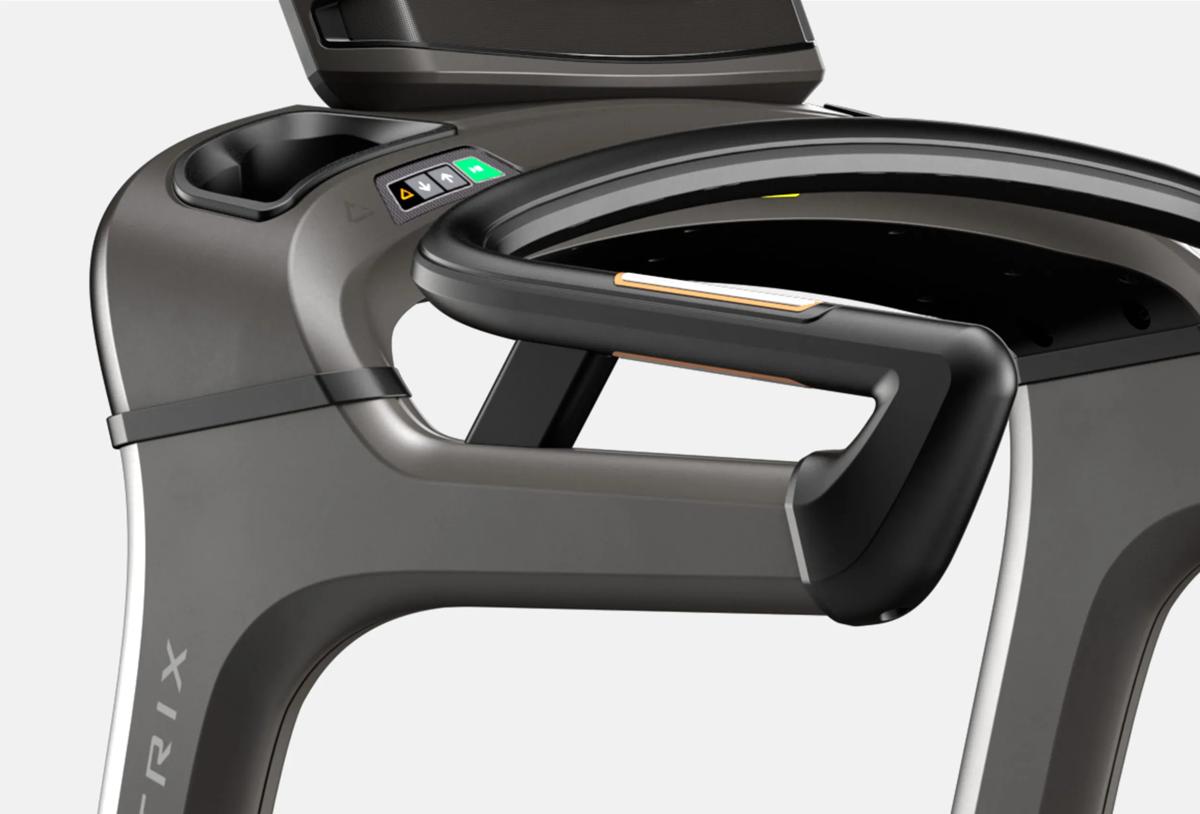 Woman using controls on Climbmill handlebars