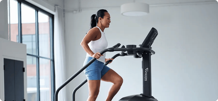 Woman exercising on the Vision Summit Stairclimber.