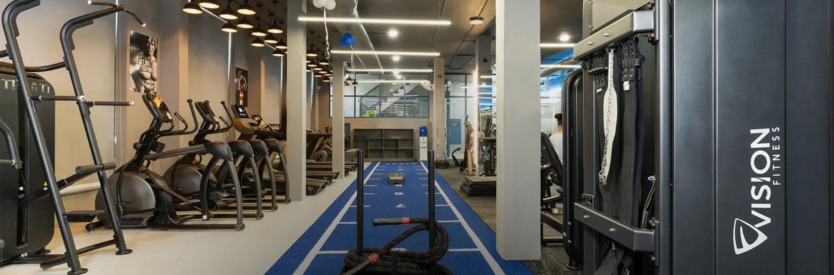 Interior view of Pulse Fitness, with several pieces of Vision cardio and strength equipment.