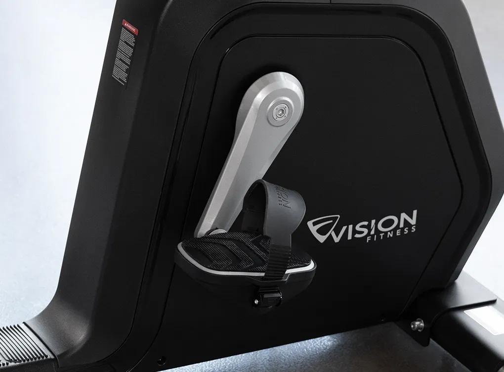 Close-up of the Summit Recumbent Bike's resistance system and reinforced crank attached to its pedal.