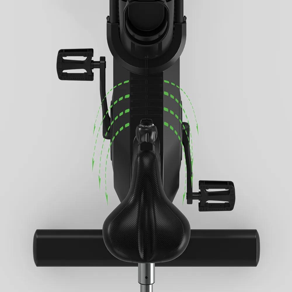 Top-down view of an adjustable bike seat with green arrows indicating tilt adjustments.