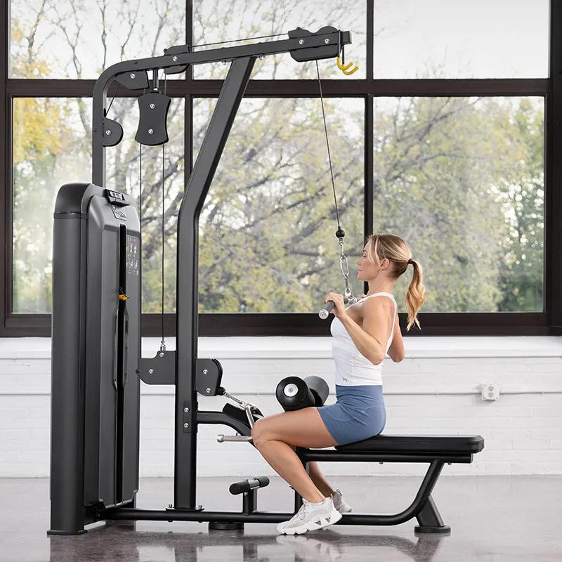 Person performing a lat pulldown on the Keystone Lat Pulldown / Seated Row machine, seated with back upright and pulling the bar down toward the chest.