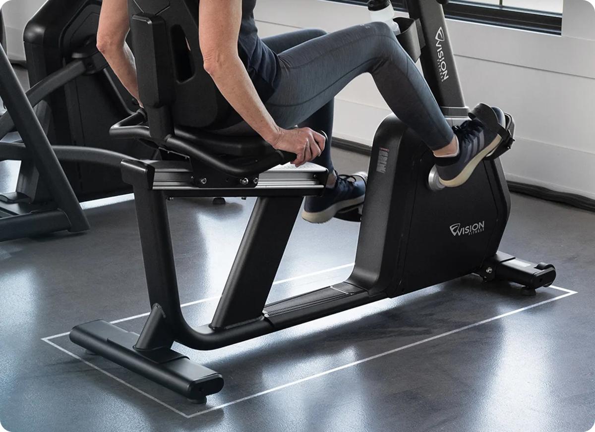 Close-up of the bottom half of the Summit Recumbent Bike while in use.
