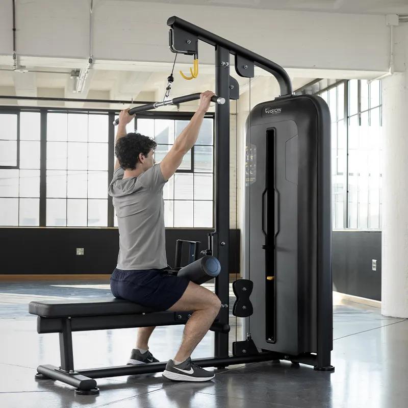 Person using the lat pulldown function on the Access Lat Pulldown / Seated Row, highlighting its clean aesthetic and shielded weight stack.