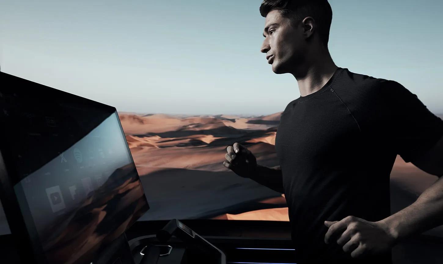 Male athlete using an Onyx Treadmill in front of desert imagery.
