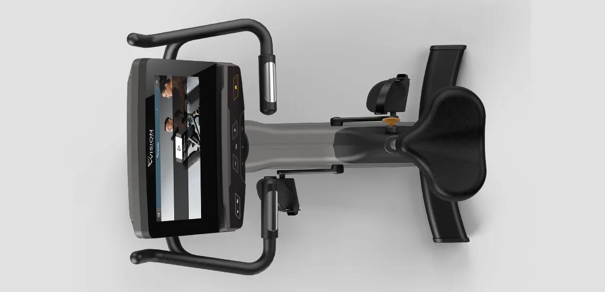 Overhead view of the Vision Fitness Upright Bike, highlighting the console screen displaying an interactive training session, seat, and pedals.