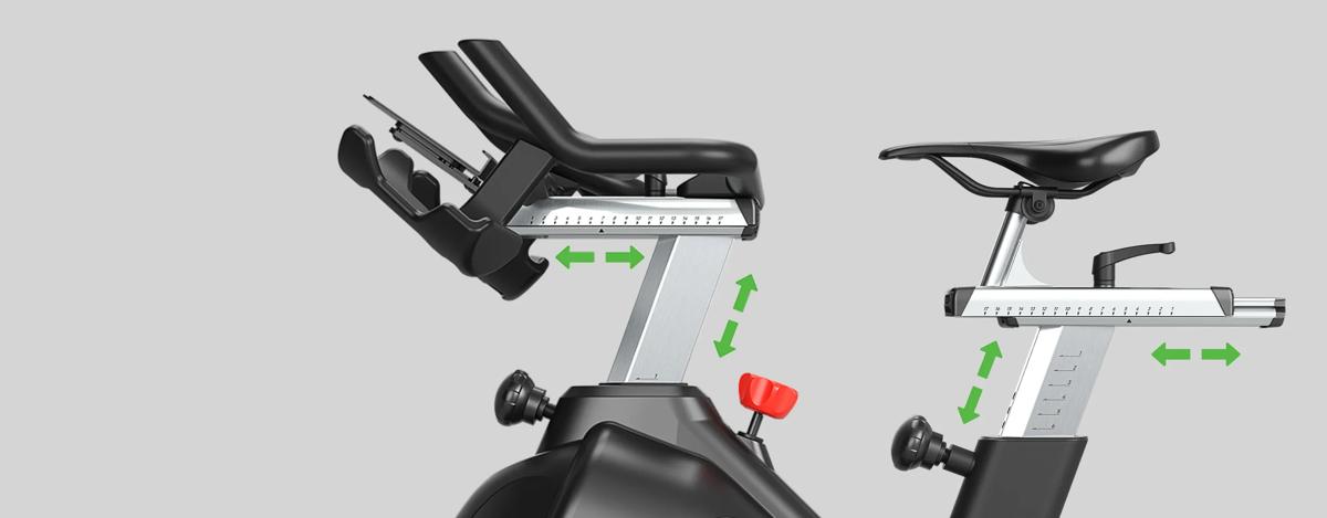 Close-up of the IC700 Indoor Cycle with green arrows indicating customizable seat height and horizontal positioning for an ergonomic fit.