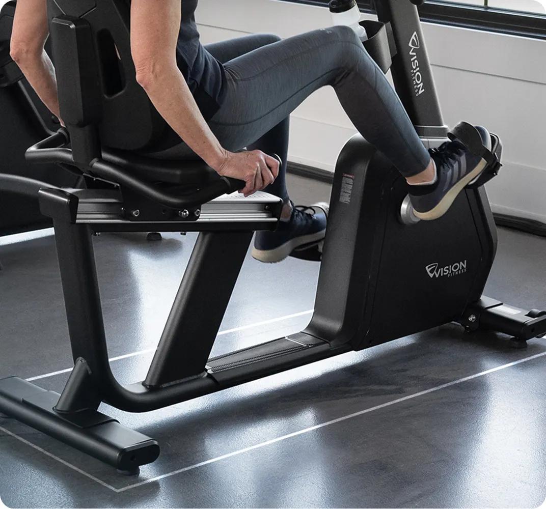 Close-up of the bottom half of the Summit Recumbent Bike while in use.