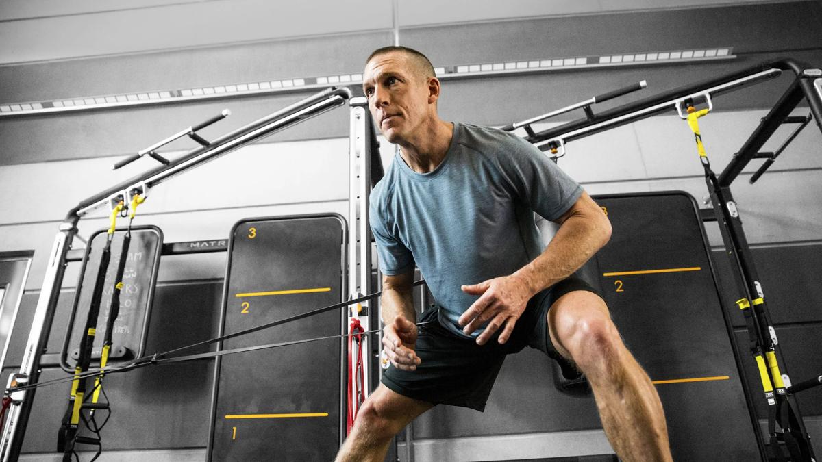 Man using Connexus with resistance bands