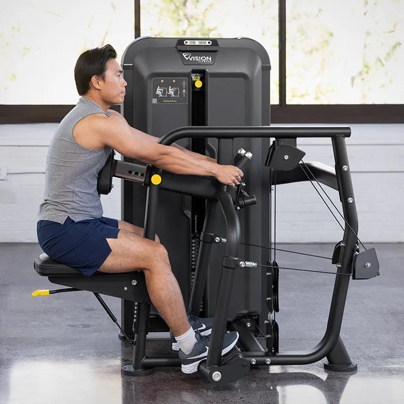 Person using the Keystone Diverging Seated Row machine in the starting position, seated with chest against the pad and arms extended to grip the independent handles.