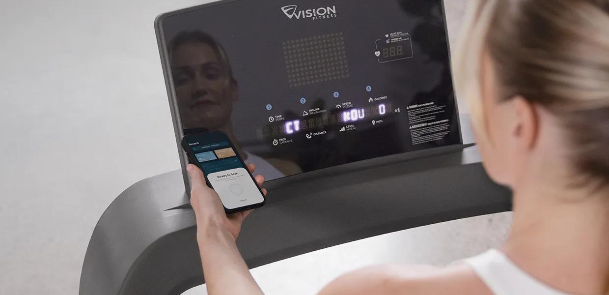 Person tapping their phone on the console to connect account