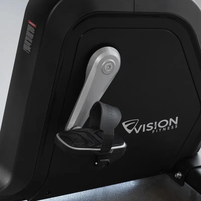 Close-up of the Summit Recumbent Bike's resistance system and reinforced crank attached to its pedal.