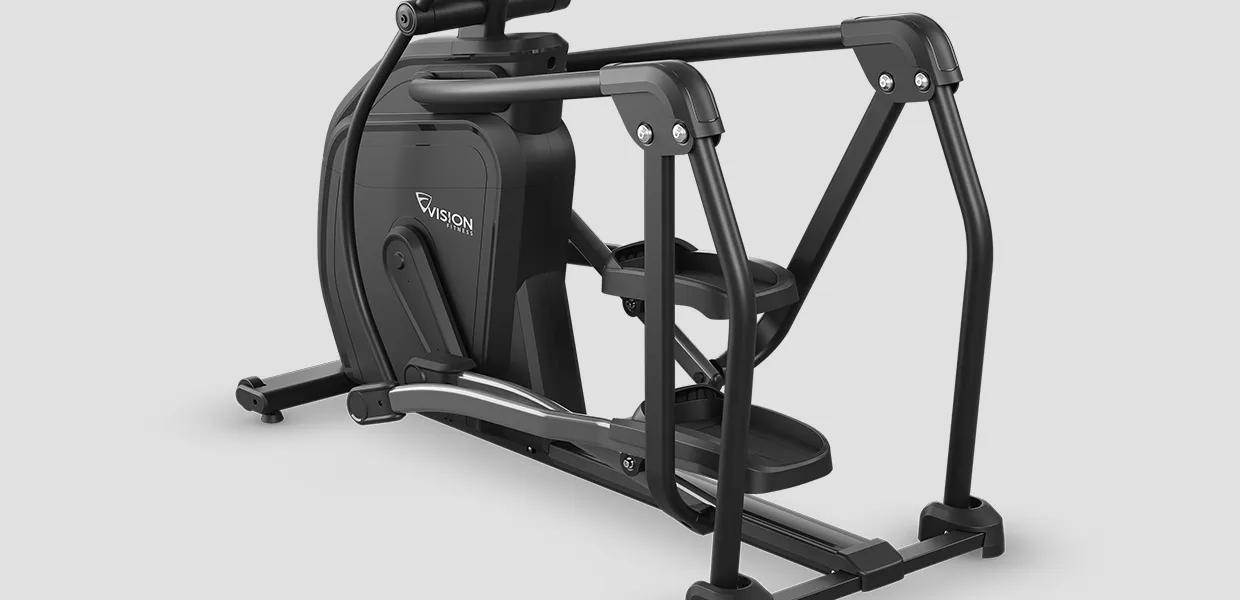 Rear angled view of the lower half of the Summit Ascent Trainer, showing the frame, pedals and resistance system.