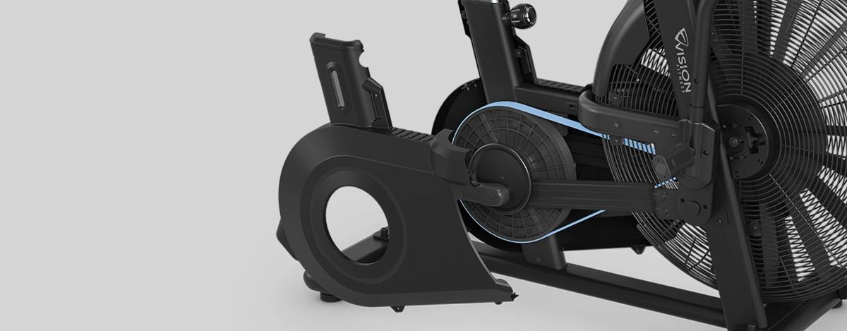A close-up view of the AB700 Air Bike's belt drive system, featuring a large fan wheel and a protective casing partially removed to reveal the internal mechanism.